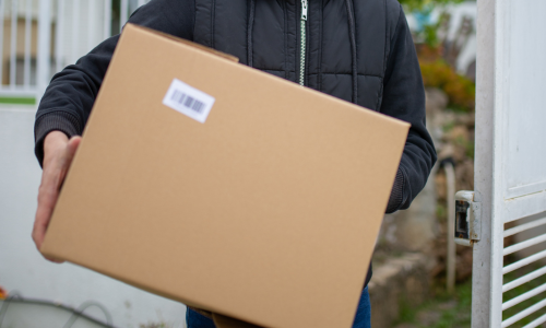 A large cardboard box being carried