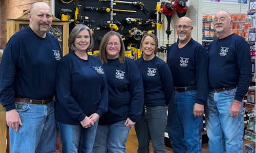 B & B Farm Supply staff standing as a group inside of the store.